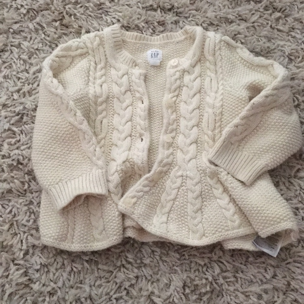 Adorable cream cable knit cardigan.